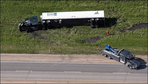 A semi is on its side along the Trans-Canada Highway near Elie.